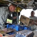 New York Army National Guard helicopters fly supplies to flood-hit towns