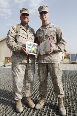 Marine father promotes Marine son in Afghanistan