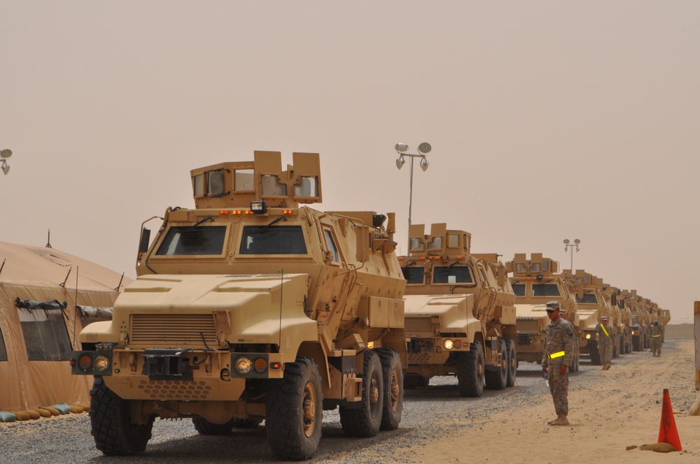 Soldiers prepare to ground guide their MRAPs
