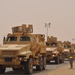 Soldiers prepare to ground guide their MRAPs