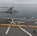 Cobra attack helicopter departs USS Makin Island