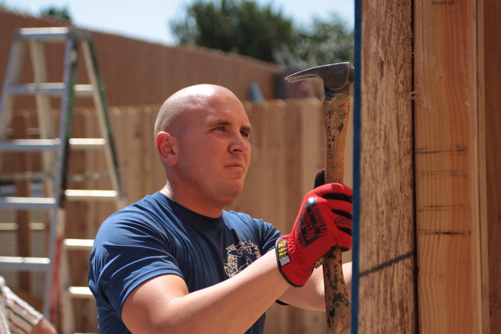 Kilo Company builds homes through Habitat for Humanity