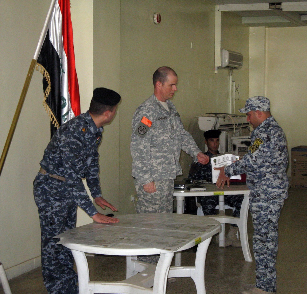 End of an era: 'Longknife' Squadron advisers see final class graduate before complete turnover of police training academy to Iraqis