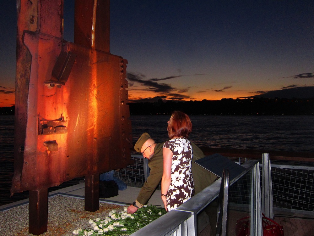 Marine lays rose at World Trade Center memorial, Sept. 9