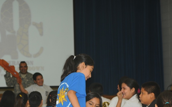 Guard soldiers teach Harlingen school children about dangers of drug use.