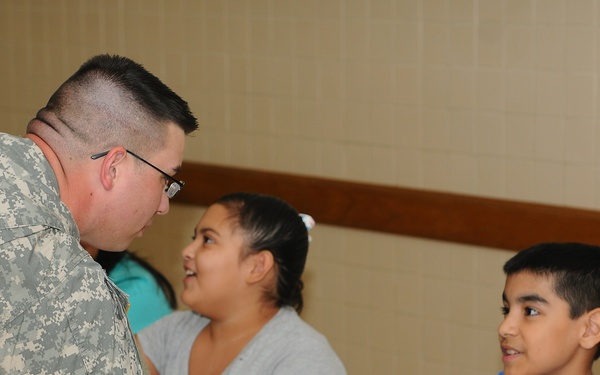 Guard soldiers teach Harlingen school children about dangers of drug use.