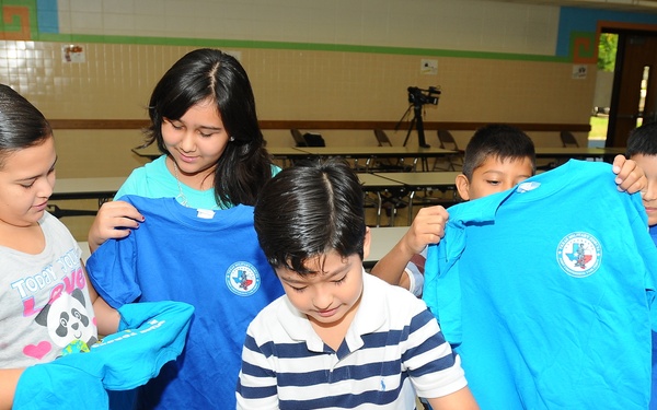 Guard soldiers teach Harlingen school children about dangers of drug use.
