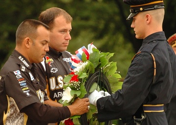 Schumacher, Newman place wreath at Arlington
