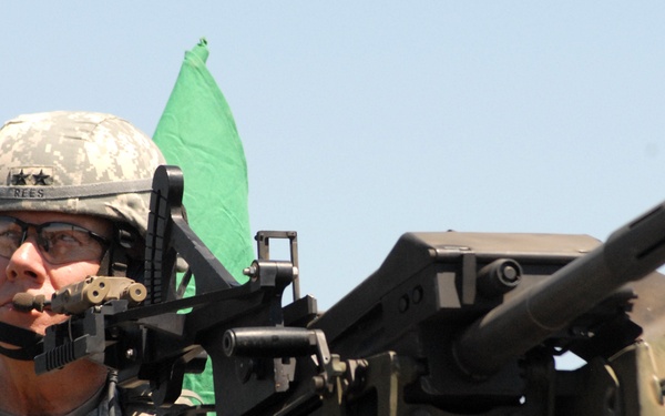 Maj. Gen. Rees prepares to fire an MK19