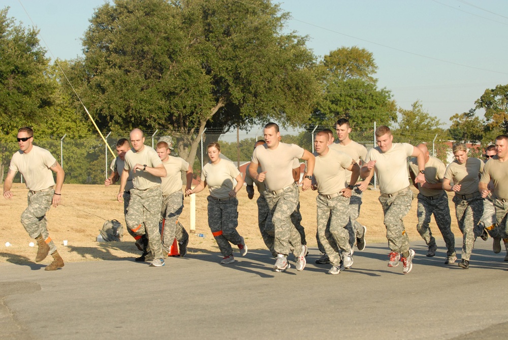 Soldiers from the 961st Engineer Battalion race towards the finish line