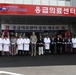 Doctors and staff along with Daegu US Army leaders cut a ribbon to celebrate the opening of the new wing at the Gumi Cha Hospital