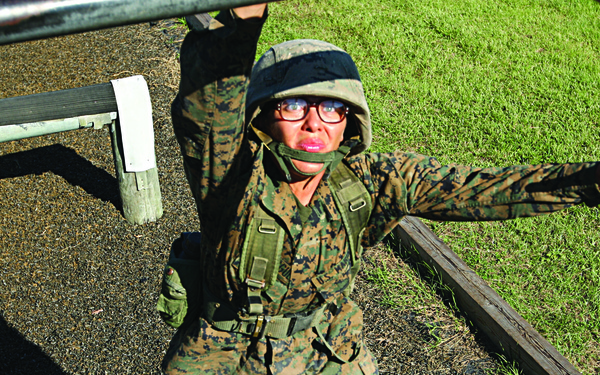 Karate instructor drop kicks recruit training