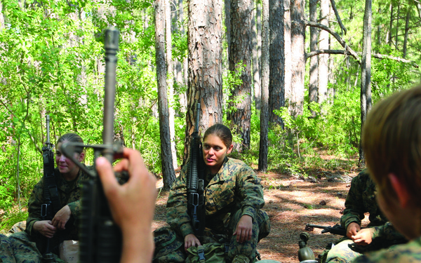 Karate instructor drop kicks recruit training