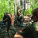 Karate instructor drop kicks recruit training