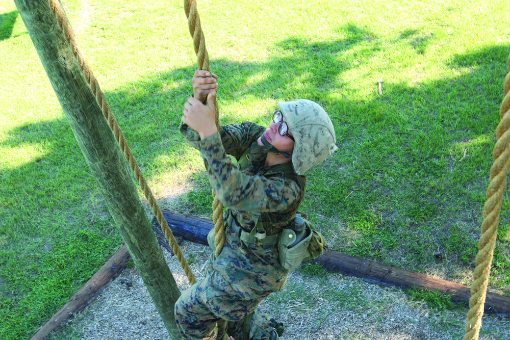Karate instructor drop kicks recruit training