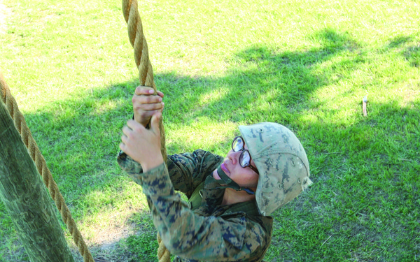 Karate instructor drop kicks recruit training