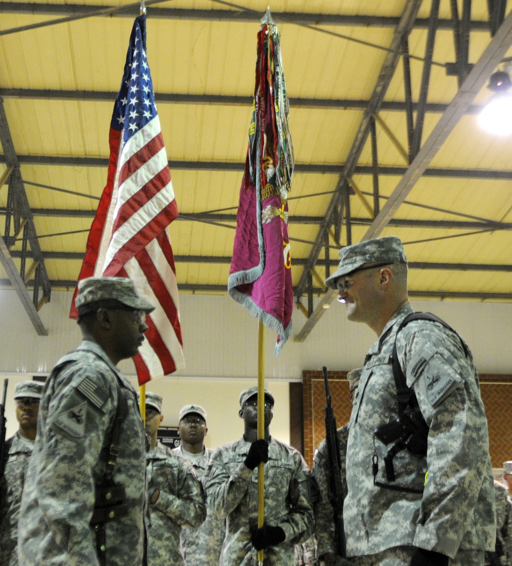 Soldiers of the 123rd Brigade Support Battalion uncase their unit colors, assume their mission in Iraq