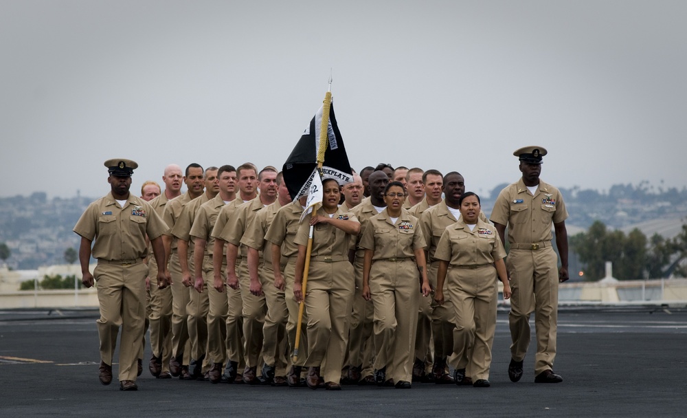 Chief petty officer selects march before pinning ceremony