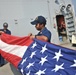 USS Truxtun sailors fold flag