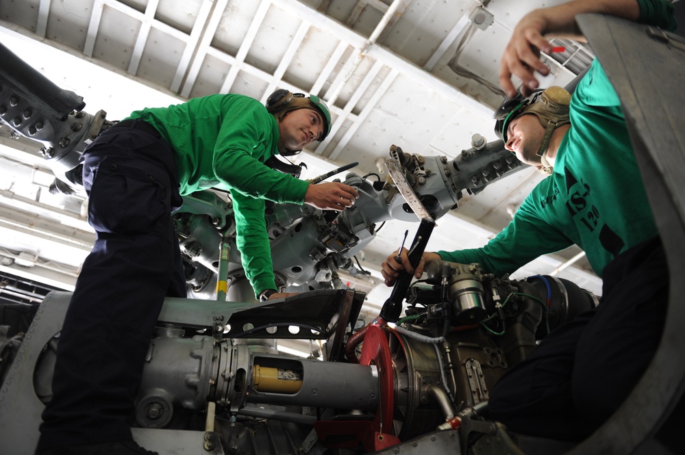 Aviation mechanics conduct routine maintenance