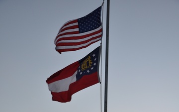 Flag ceremony at sunset