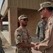 Maj. Gen. Jim Jones tours an undisclosed location in Southwest Asia