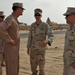 Maj. Gen. Jim Jones tours an undisclosed location in Southwest Asia