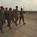 Maj. Gen. Jim Jones tours an undisclosed location in Southwest Asia