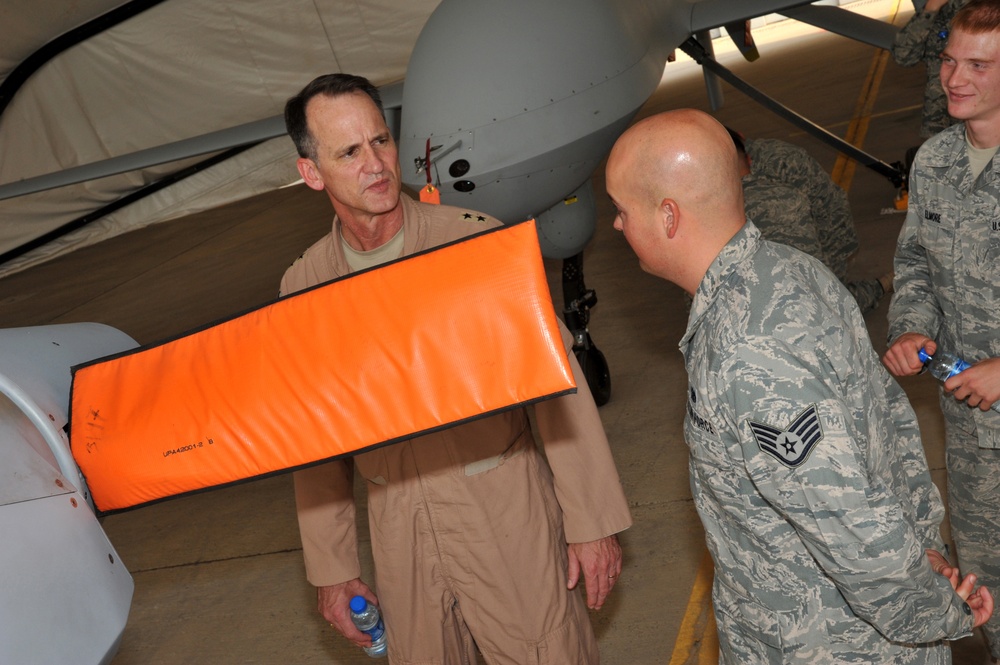Maj. Gen. Jim Jones tours an undisclosed location in Southwest Asia