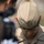 New SACEUR makes first visit to Kosovo A high-ranking U.S. Marine Corps officer is photographed with head bowed, wearing a tan/khaki service uniform. The officer displays four silver stars on both the collar and garrison cap, indicating the rank of General (O-10). A gold Marine Corps Eagle, Globe, and Anchor emblem is visible on the cap.