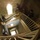 New SACEUR makes first visit to Kosovo A fisheye-lens photograph taken from above looking down a multi-story interior stairwell with stone walls. Several individuals wearing camouflage military-style clothing are visible on the stairs at various levels. The image has motion blur on some figures, suggesting movement during a longer exposure.