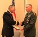 Col. Michael F. Davino receives the Legion of Merit