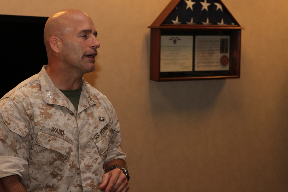 Maj. Christopher Dolson receives Navy Commendation Medal