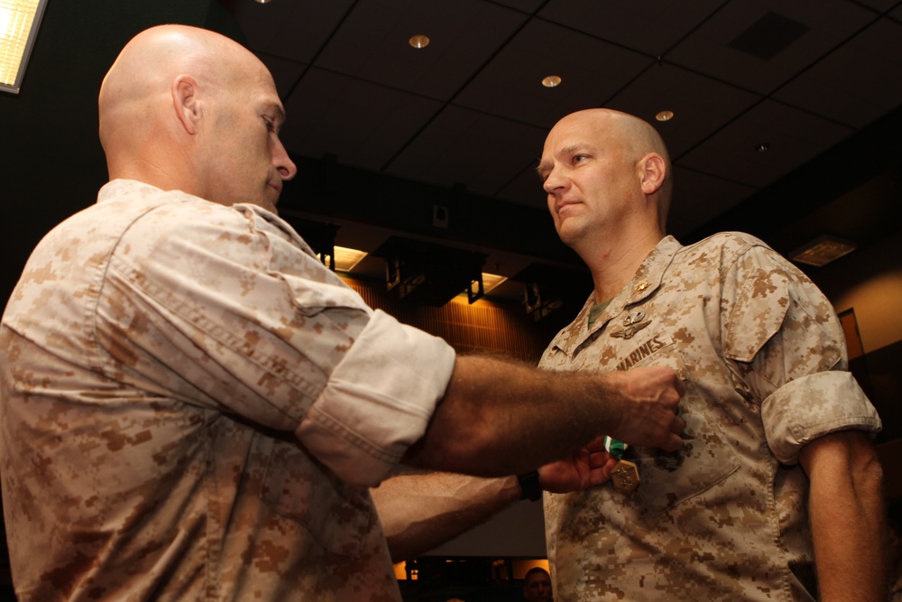Maj. Christopher Dolson receives Navy Commendation Medal
