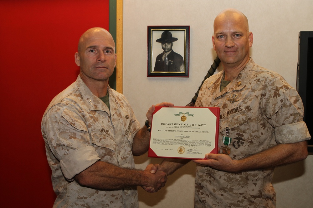 Maj. Christopher Dolson receives Navy Commendation Medal