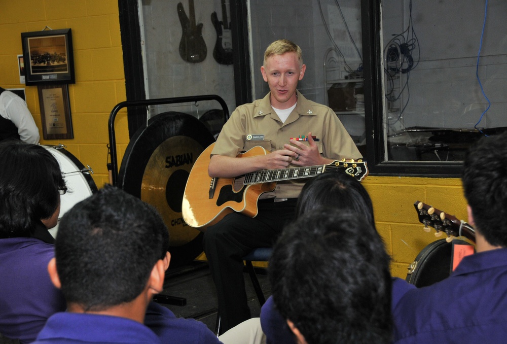 Musician plays for Guam high school students