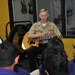 Musician plays for Guam high school students