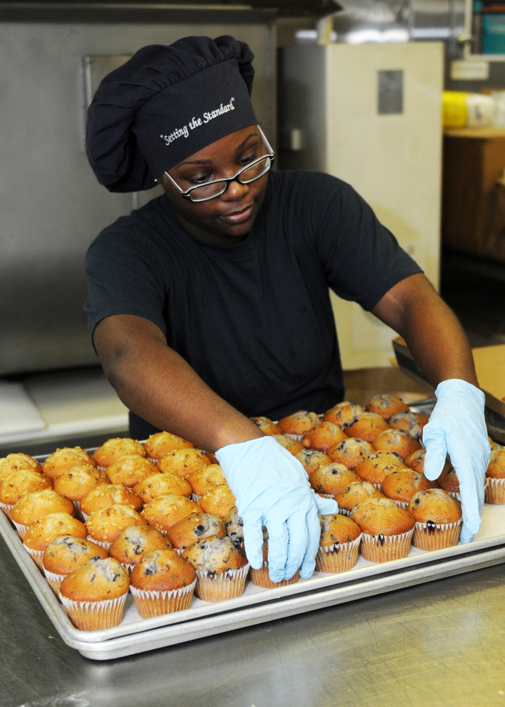 USS George H.W. Bush sailors prepares muffins