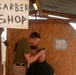 Marine cuts another's hair