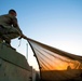 Marine pulls shade above gym