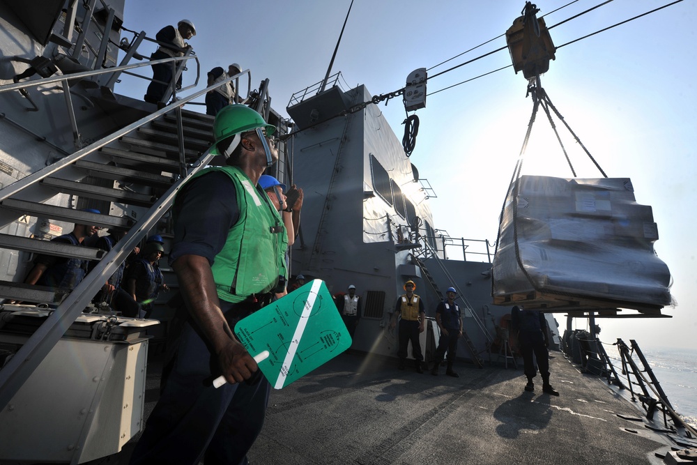 USS Truxtun sailor during replenishment at sea