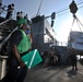 USS Truxtun sailor during replenishment at sea