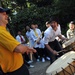 USS George Washingto sailor plays drums with children