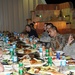 Iraqi soldiers and US paratroopers share one last meal together