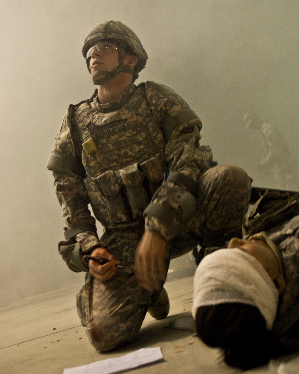Barger evaluates a casualty in the smokey haze