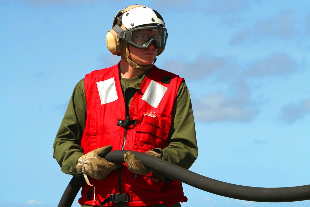 Marines, sailors participate in a fire fighting exercise