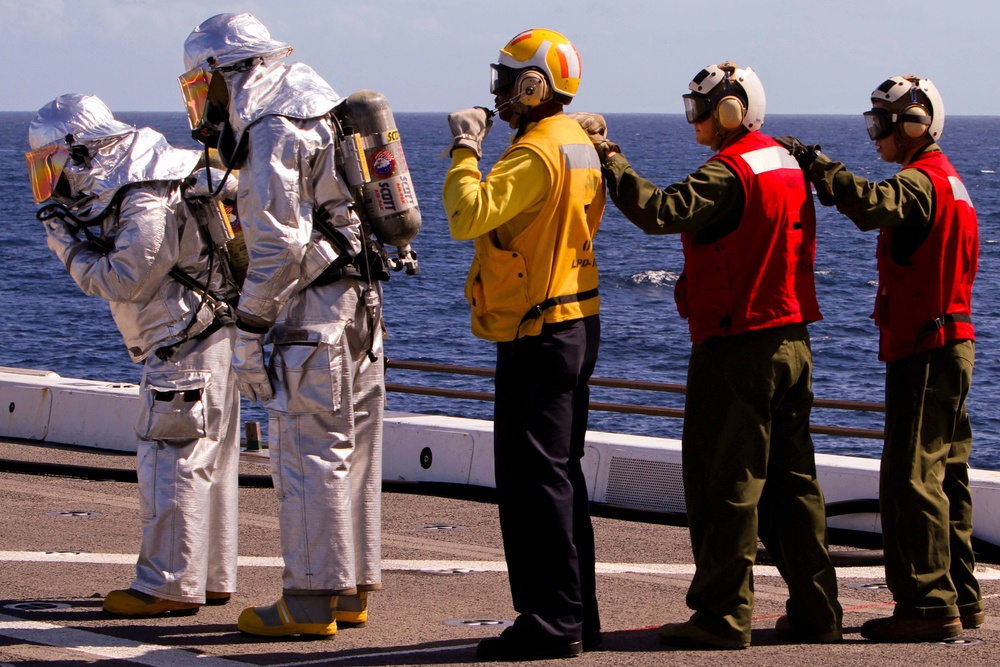 Marines, sailors participate in a fire fighting exercise