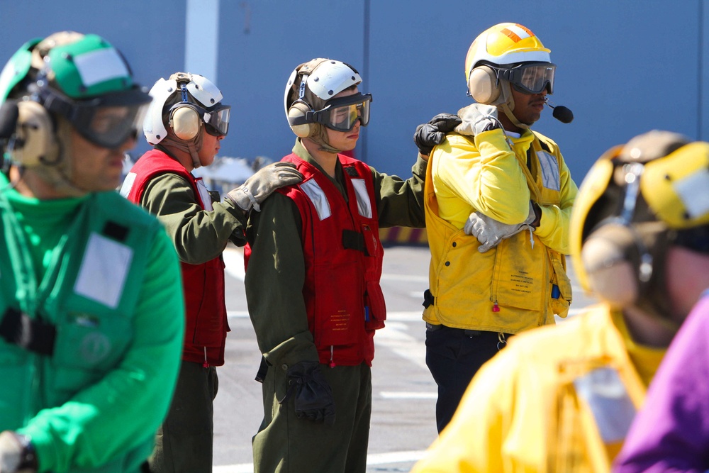 Marines, sailors participate in a fire fighting exercise