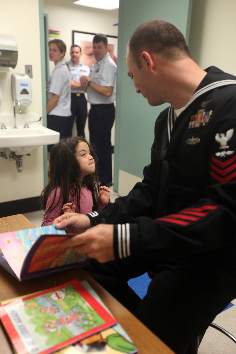 Service members at Fleet Week visit children at San Francisco General Hospital
