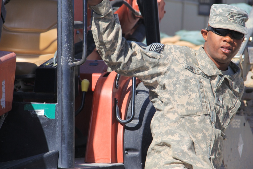 580th Signal soldier digs the ditch for signal operations